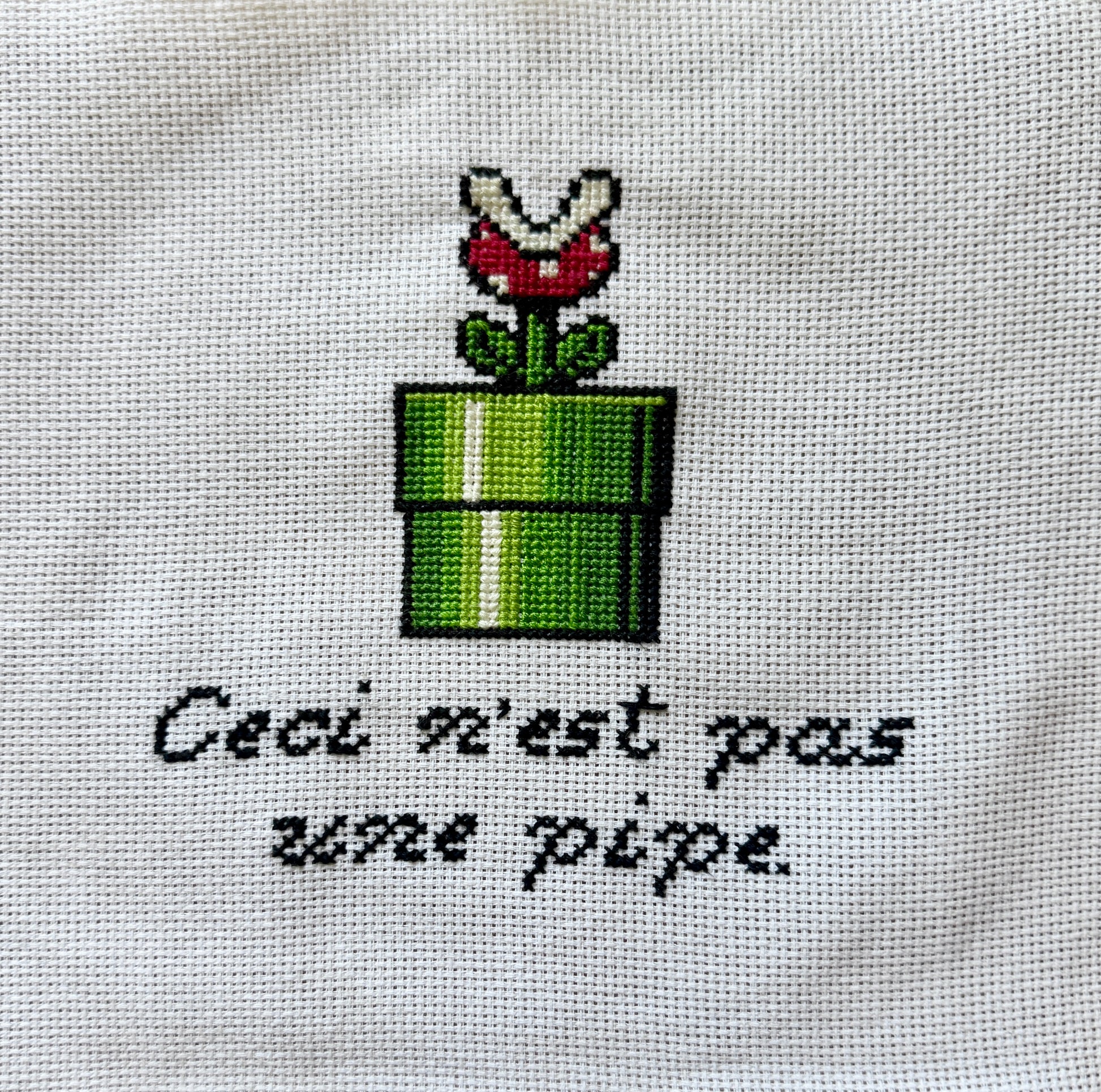 "Ceci n'est pas une pipe" piranha plant cross stitch pattern - 